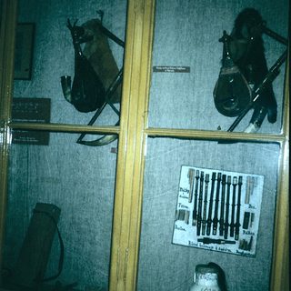 Historical weapons and tools display case.