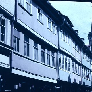 Historic European street with timber-framed buildings.