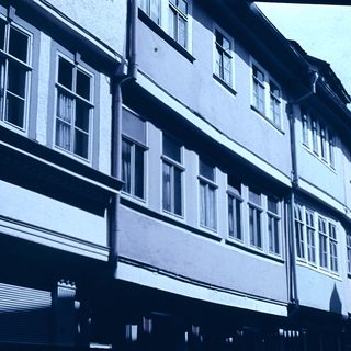 Historic European street with timber-framed buildings.
