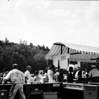Outdoor food preparation and serving event.