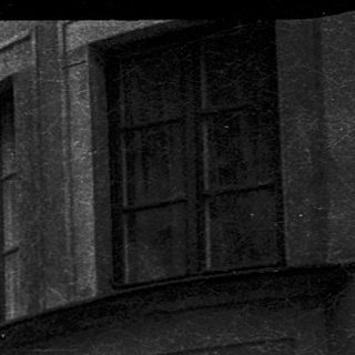 Abandoned historic building with damaged walls.