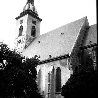 Historic church with tall steeple and Gothic architecture.