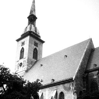 Historic church with tall steeple and Gothic architecture.