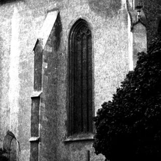 Historic church with tall steeple and Gothic architecture.