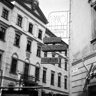 Historic building with vintage restaurant sign "Dieva Restauracija Ruter".