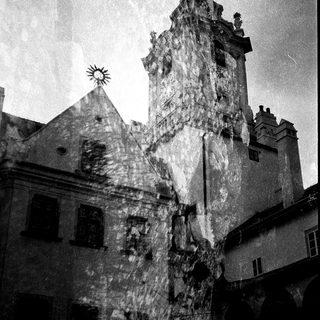 Historic European town with medieval stone tower.