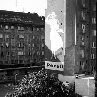Persil laundry detergent billboard in urban setting.