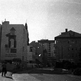 Historic urban street scene with old building and signage.