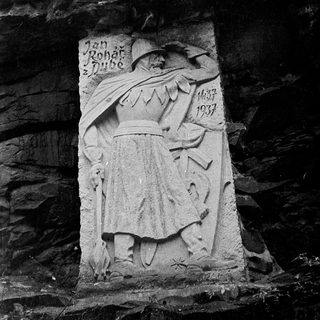 Carved stone relief of Jan Roháč with dates 1380–1437.