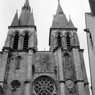 Gothic cathedral spires and rose window facade.