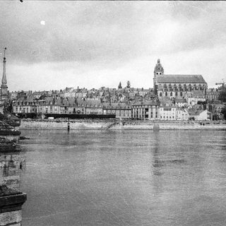 Aerial view of a historic canal cityscape.