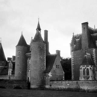 Medieval castle with turrets and fortified walls.