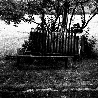 Bell structure suspended among tree branches.