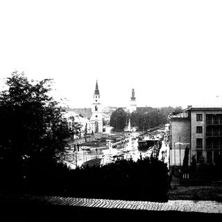 Historic town square with church spires and buildings.