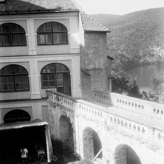 Historic building with arched passageways and courtyard.
