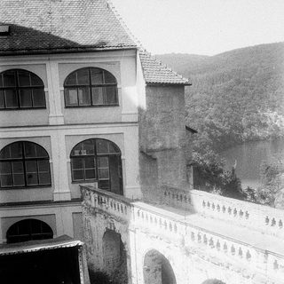 Historic building with arched passageways and courtyard.