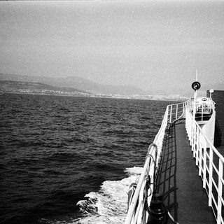 Boat deck view of open sea.