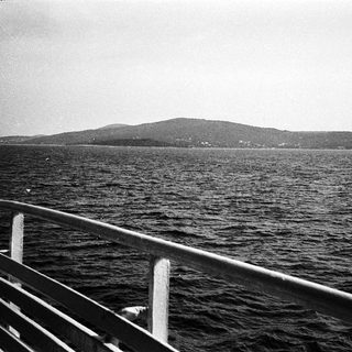Coastal view from a ship deck.