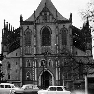 Gothic-style church facade with scaffolding, mid-20th century.