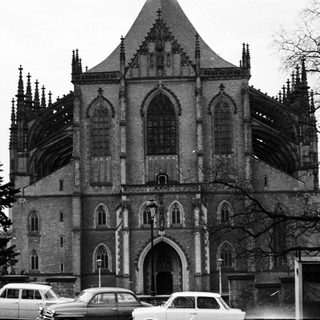 Gothic-style church facade with scaffolding, mid-20th century.