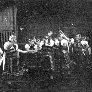 Traditional folk dance performance in colorful costumes.
