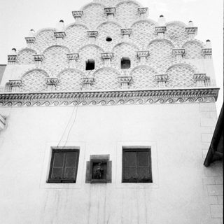 Decorative ceiling with geometric, lattice-like window panels.