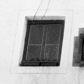 Decorative ceiling with geometric, lattice-like window panels.