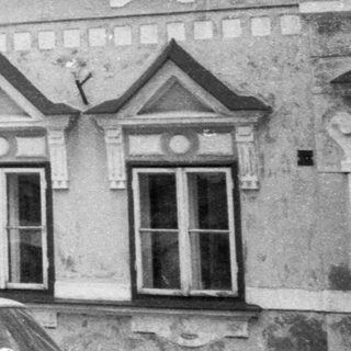 Traditional European townhouses with gabled facades.
