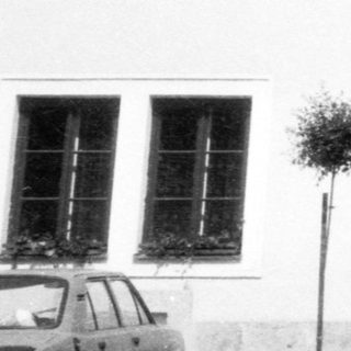 Historic gate marked "Založen 1379" with archway.