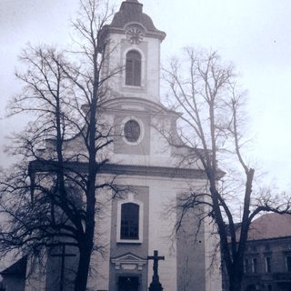 Neoclassical church with tall bell tower.