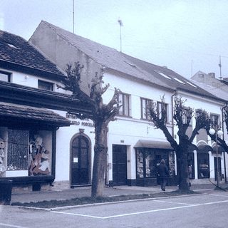 Vintage street view of small-town shops and buildings.