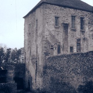 Stone fortress tower with defensive walls.