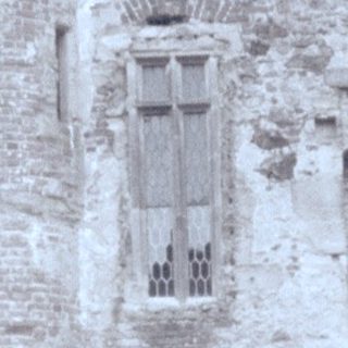Medieval stone castle courtyard with old architecture.