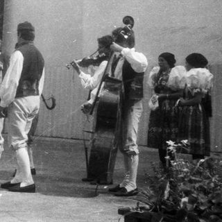 Traditional folk band performing outdoors.