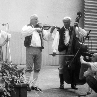 Traditional folk musicians performing outdoors.