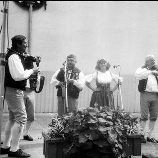 Traditional folk musicians performing outdoors.