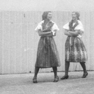 Traditional folk group performing indoors.