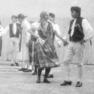 Traditional folk dance performance in traditional attire.