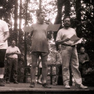 Group performing or rehearsing a theatrical play outdoors.