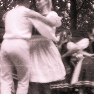 Vintage outdoor dance scene with couples dancing.