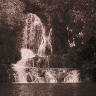 Majestic waterfall cascading into calm pool.