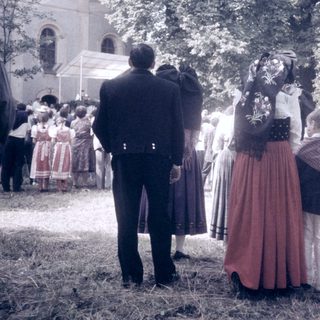Traditional folk festival gathering with cultural attire.