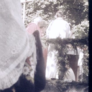 Traditional folk costumes in outdoor setting.