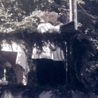 Traditional outdoor wedding ceremony under canopy.