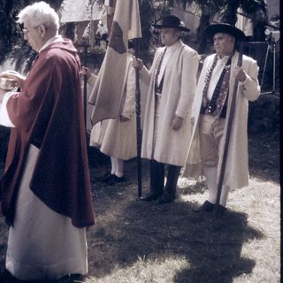 Historic reenactment with period costumes and flags.