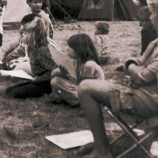 Medieval reenactors demonstrating historical combat techniques outdoors.