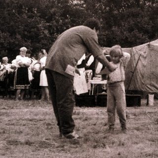 Scouting camp with tents and outdoor activities.