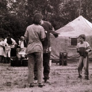 Scouting camp gathering with tents and activities.