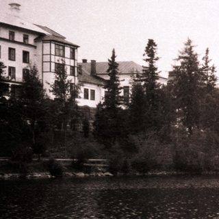 Lakefront view of historic lakeside resort buildings.