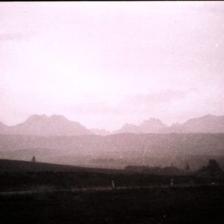 Mountain range with misty, hazy peaks.